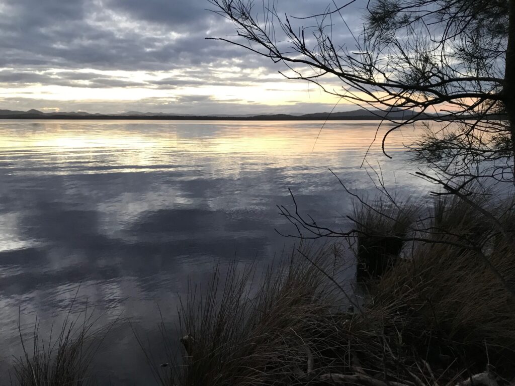 Tranquil water of Myall Lakes at dusk.