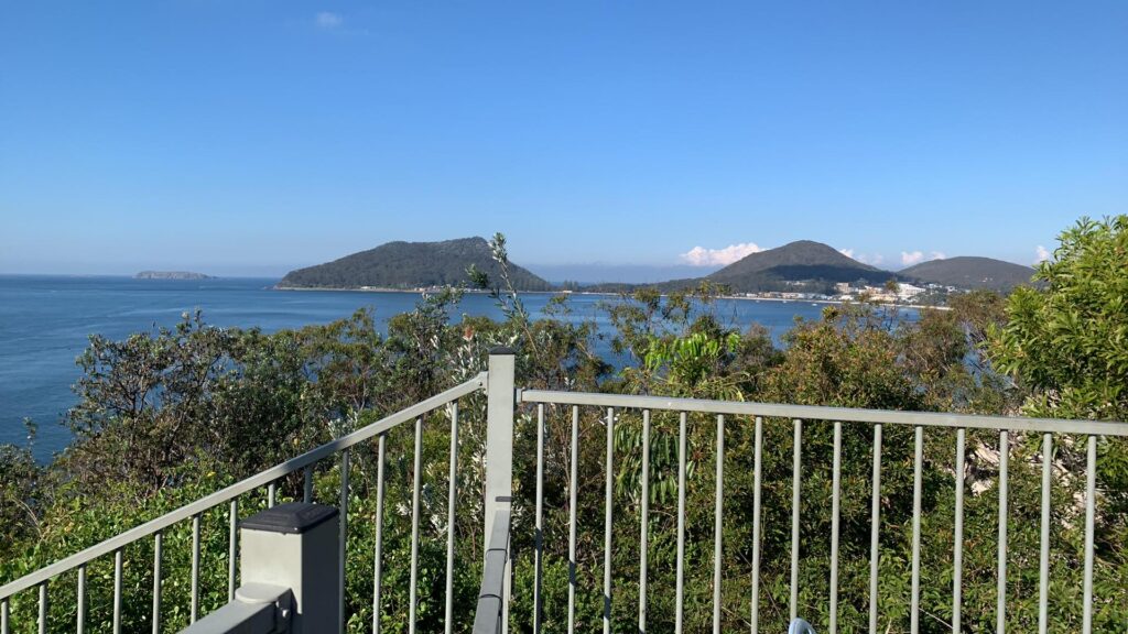 View from Inner Light Tea Rooms overlooking Shoal Bay, Port Stephens and Tomaree Headland on clear sunny day