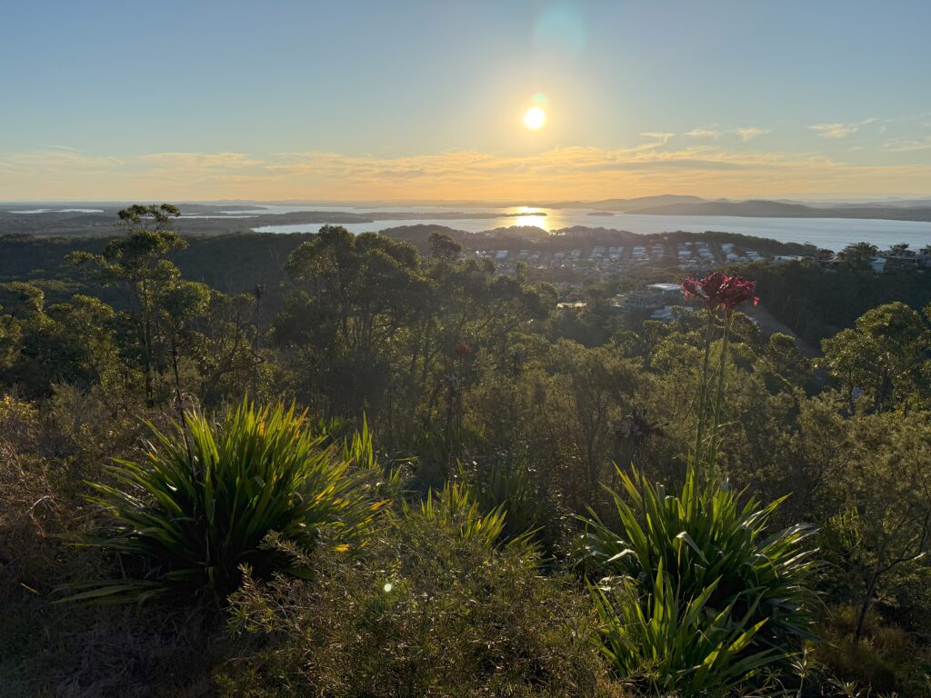Sun setting over the western harbour of Port Stephens at Gan Gan Lookout