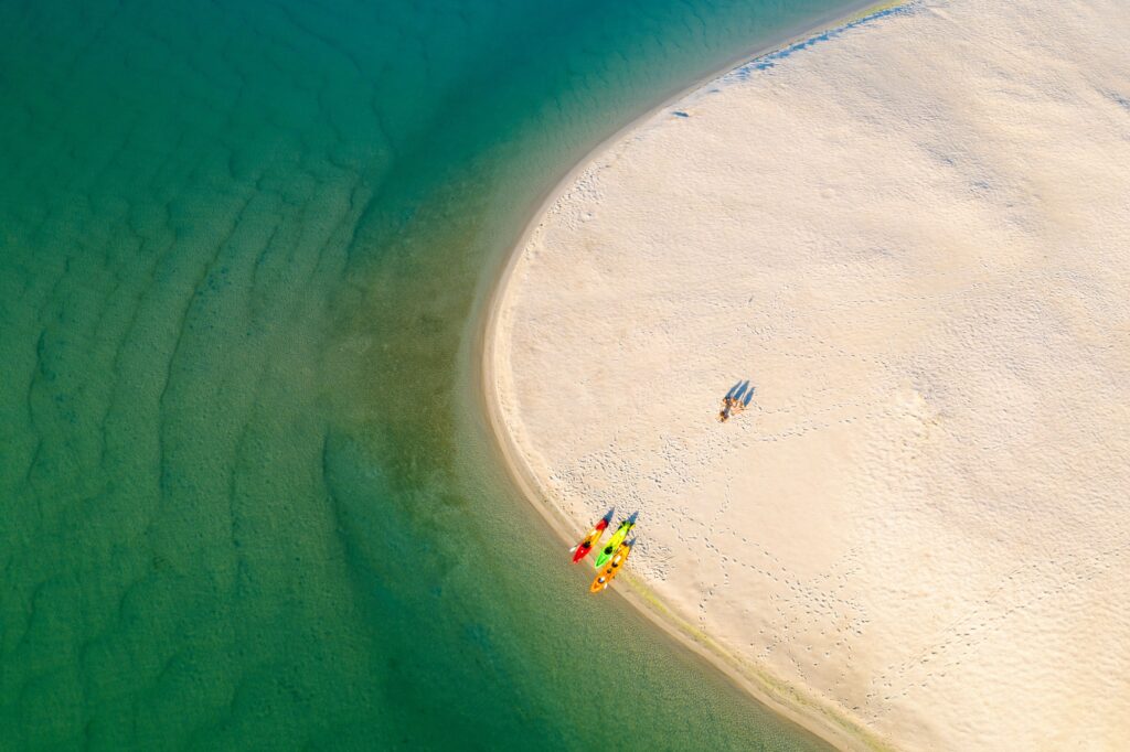 Aerial view of kayaks pulled up on the sand at Naru Beach, Lake Macquarie