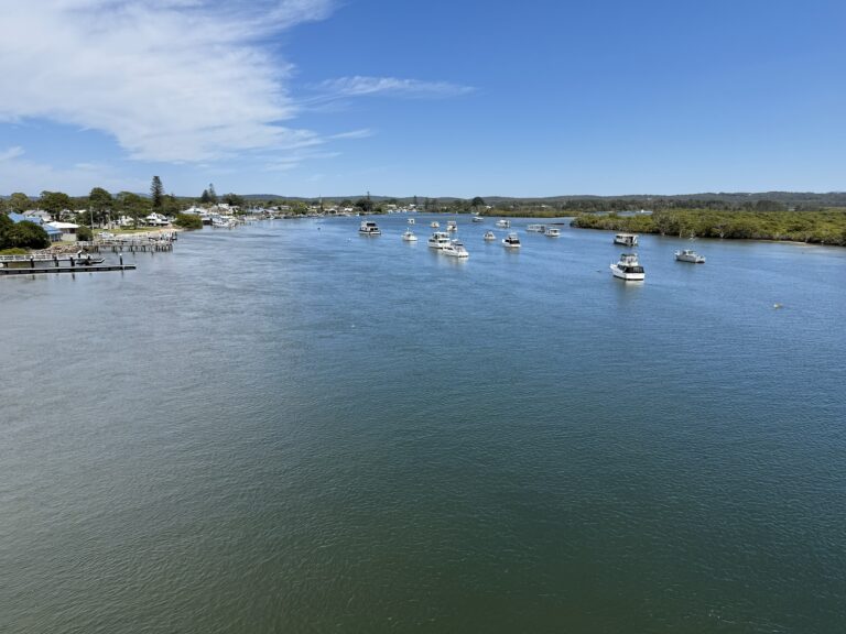 View of moored boats floating on the Myall River from the Singing Bridge