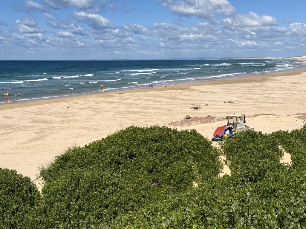 Golden sand of Birubi Beach, Port Stephens contrasted with deep blue ocean on a perfect sunny day