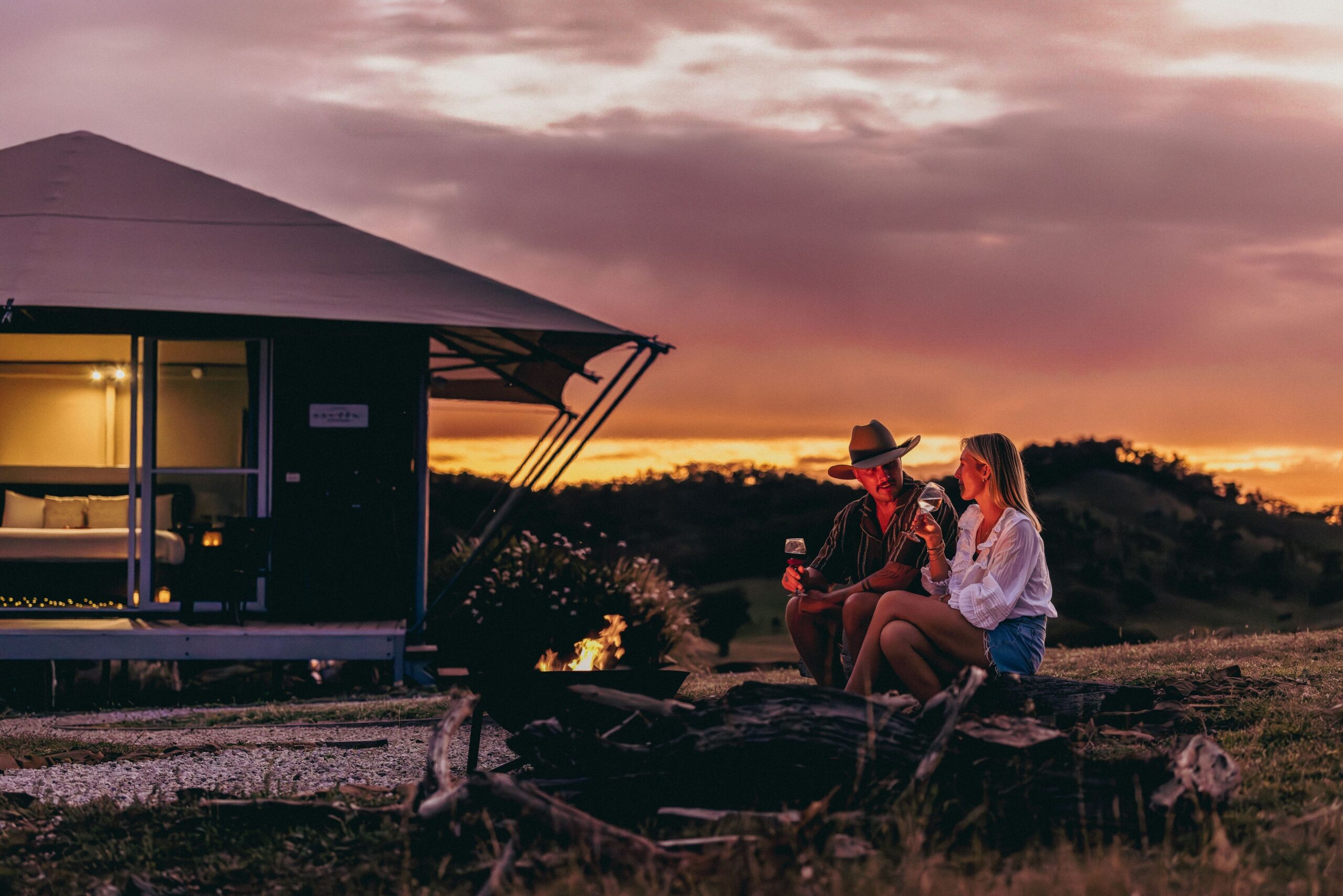 Couple enjoying a romantic evening next to the campfire in Mudgee