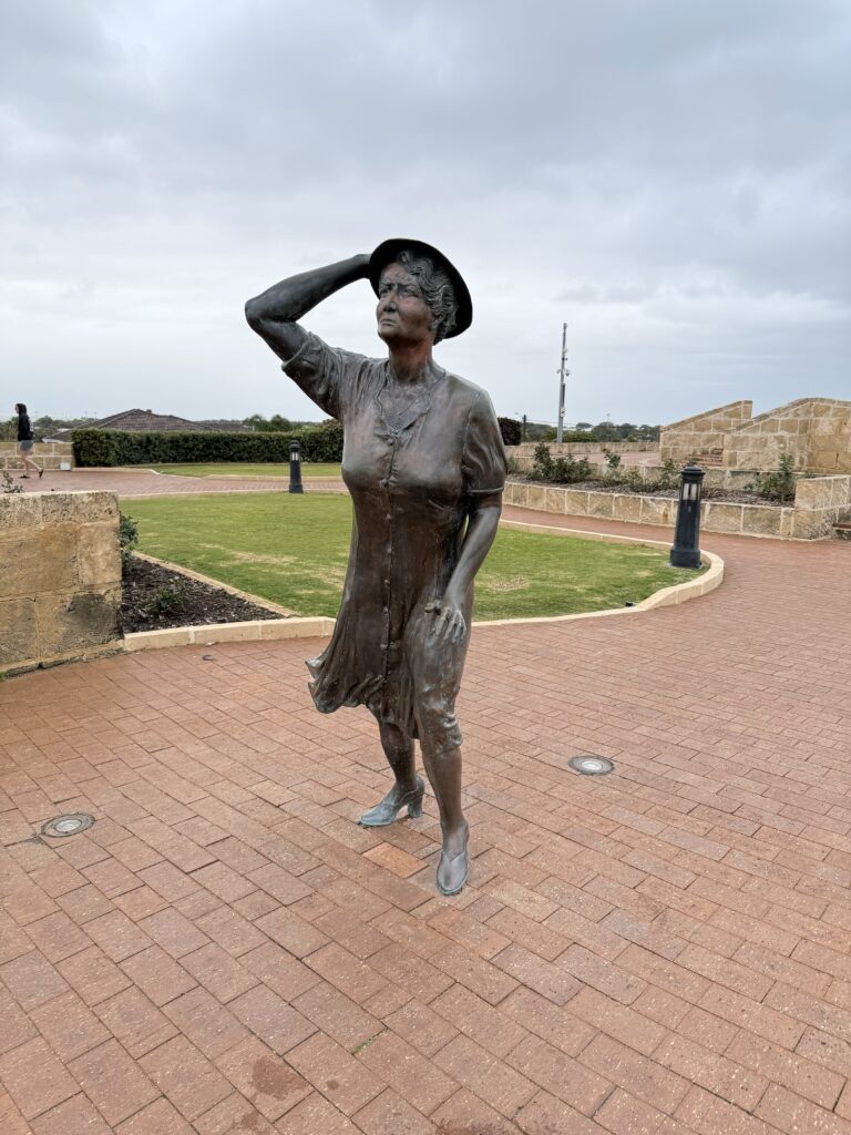 Bronze sculpture called the waiting lady looking out to sea, waiting for her menfolk to return from war