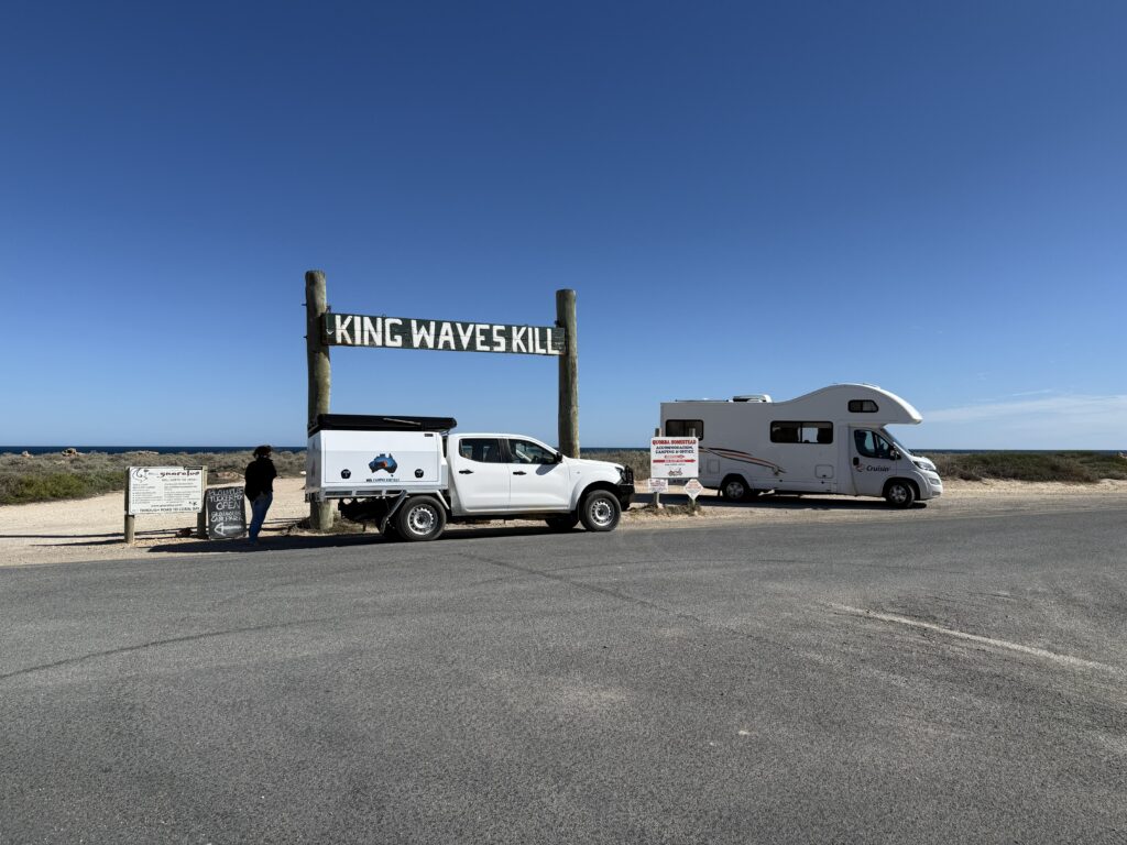 King Waves Kill sign at the Quobba Blowhole with our motorhome on Coral Coast Road Trip