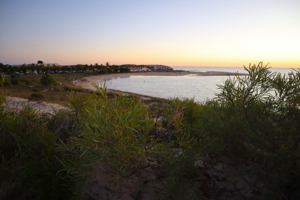 Sunset view from the sand dunes overlooking Coral Bay township and the beach