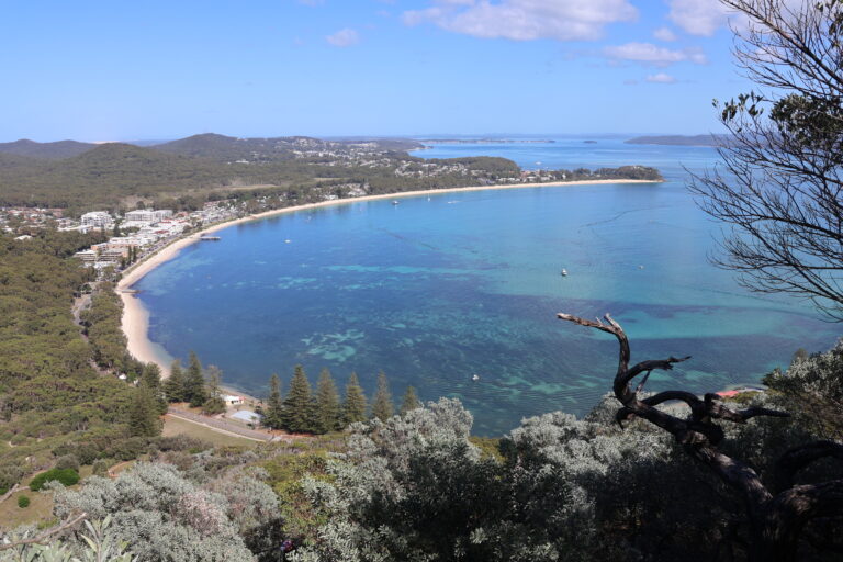 View of the turquoise waters of Port Stephens and Shoal Bay on a perfect day after climbing Tomaree Head Summit.