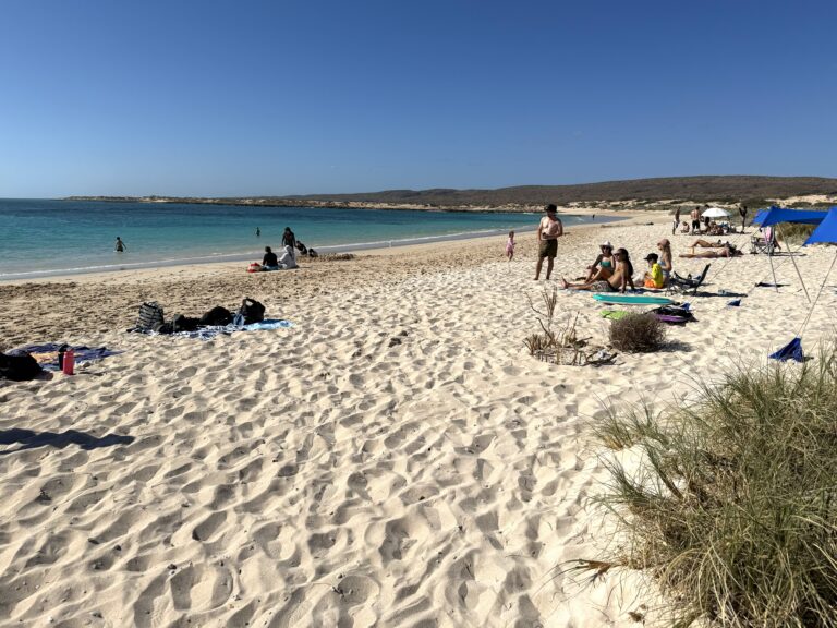 People enjoying the white sand and turquoise waters of Turquoise Bay in Ningaloo near Exmouth