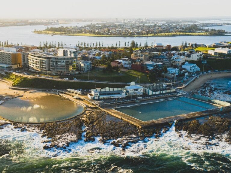 Aerial view overlooking NEwcastle Ocean Baths, the Canoe Pool, Newcastle city and Newcastle Harbour