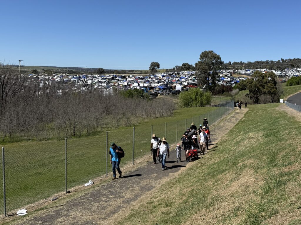 Family makes the long trek from the campgrounds to the track