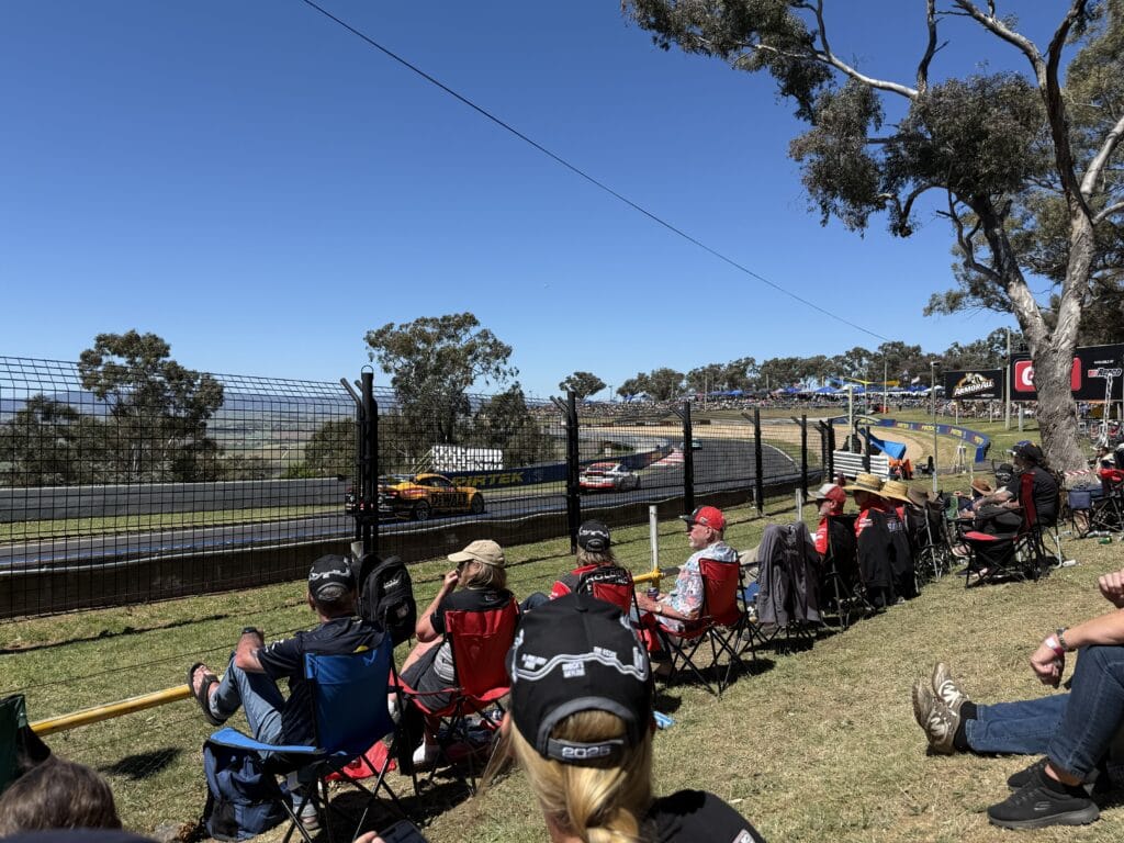 Crowds watch the racing at the top of the mountain during practice