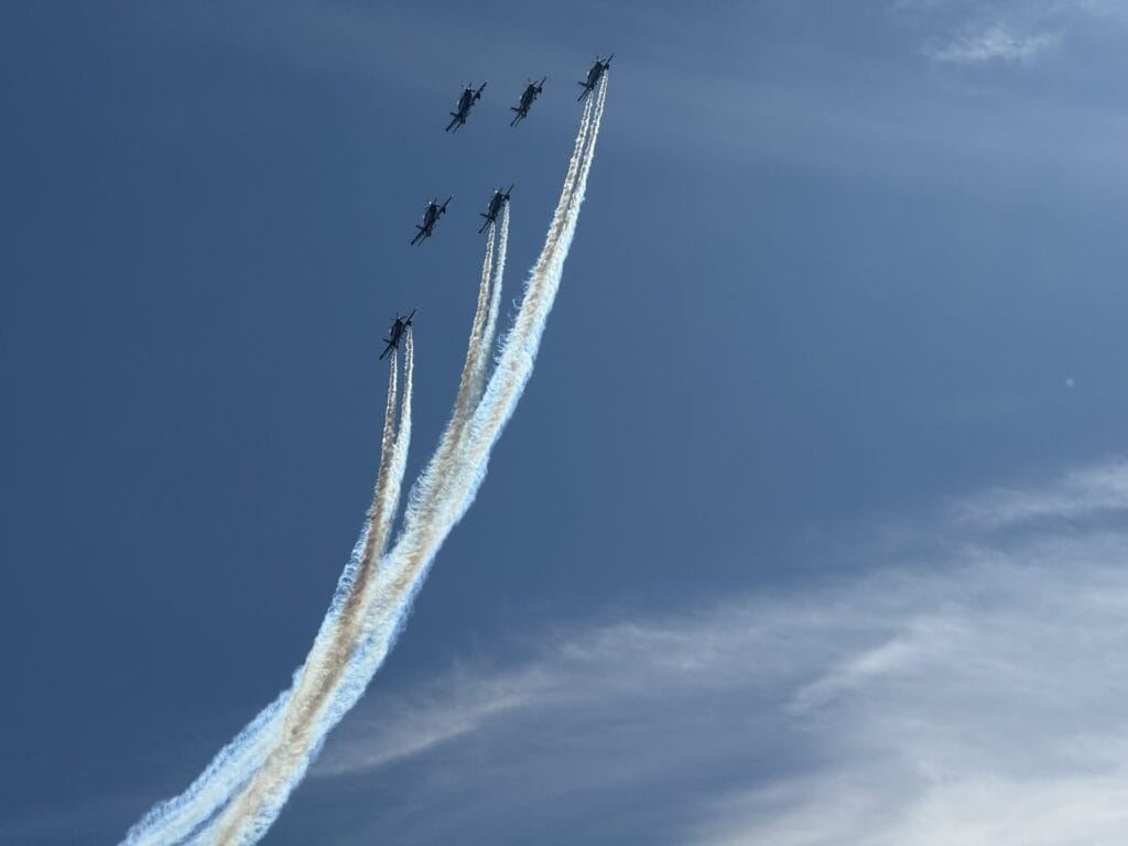The RAAF Roulettes , 6 elite aerobatic fighter training planes watched by volunteers at Bathurst 1000