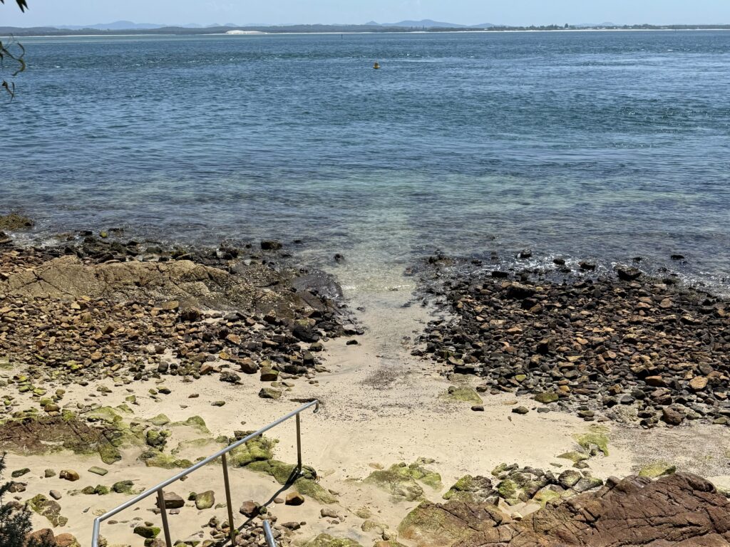 Stairs to the water and path into the water made by scuba divers at Fly Point Aquatic Park