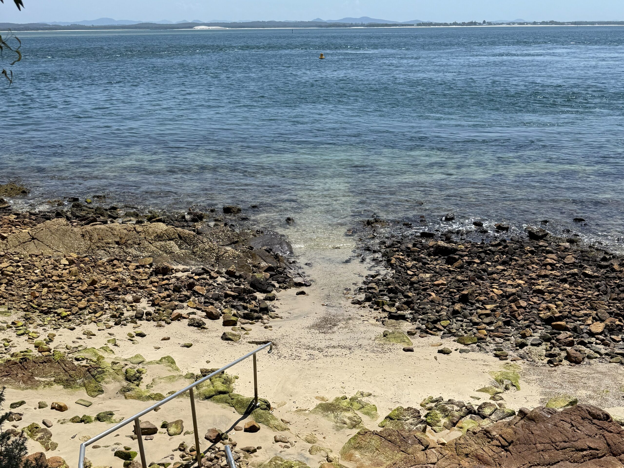 Stairs to the water and path into the water made by scuba divers at Fly Point Aquatic Park
