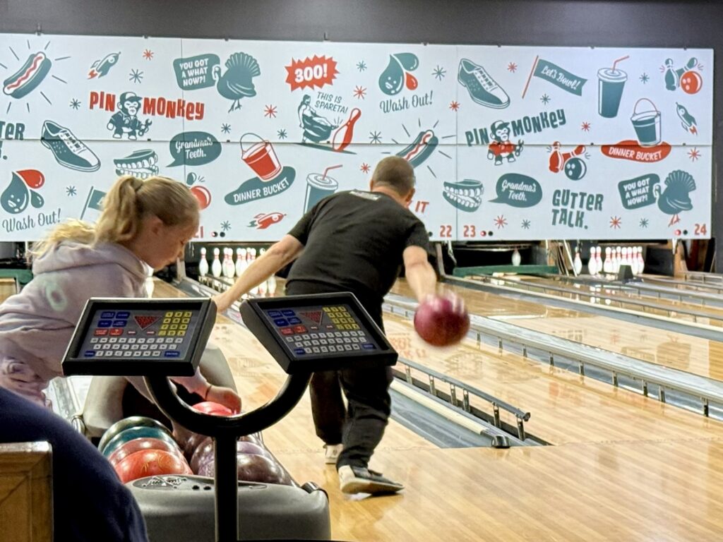 Family enjoying ten pin bowling at Dullboys Social Co at Warners Bay, Lake Macquarie on a rainy day