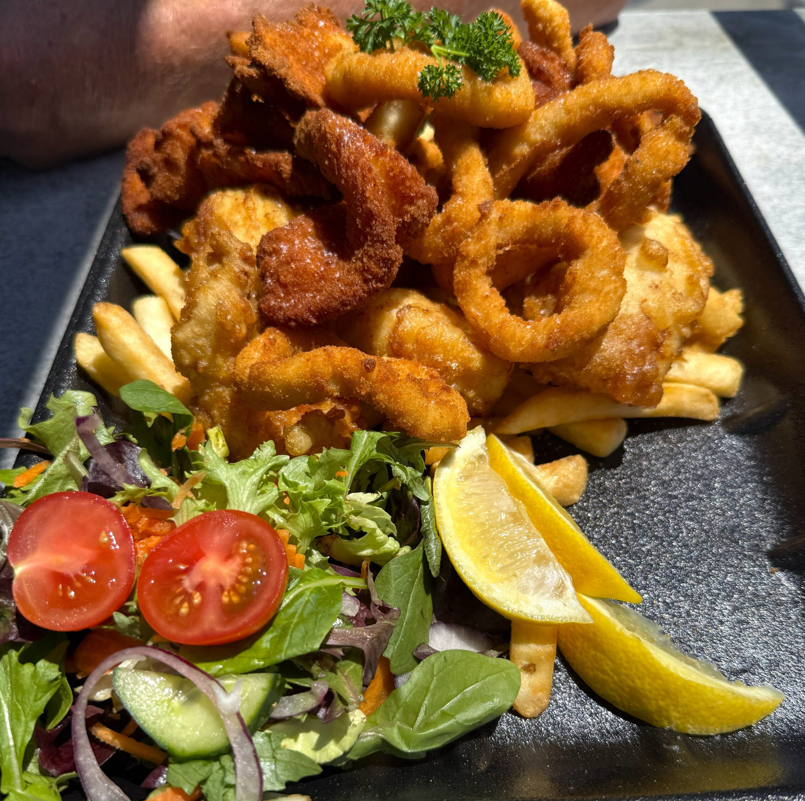 Seafood platter for 2 -crumbed calamari, battered flathead, prawns and scallops served with chips and salad.