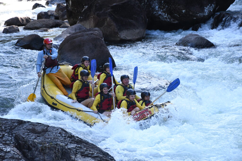 Raft folds as we drop down a rapid on the Tully River