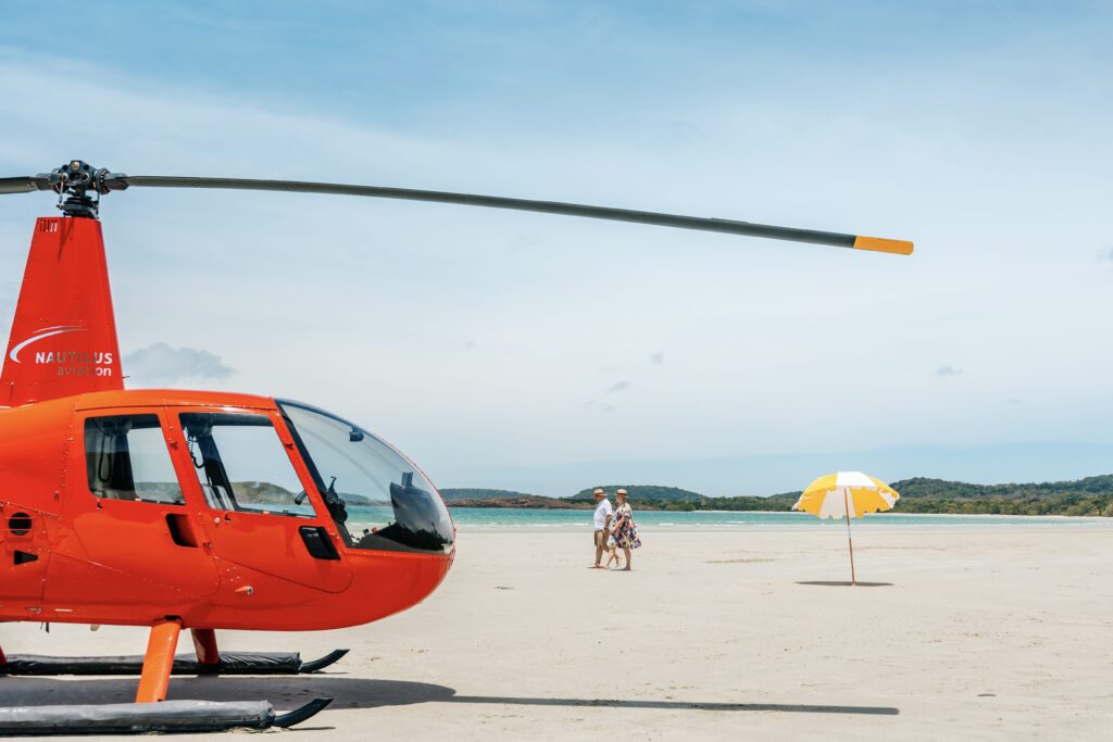 Arriving to a special picnic on a sandy beach by helicopter on the Great Barrier Reef.
