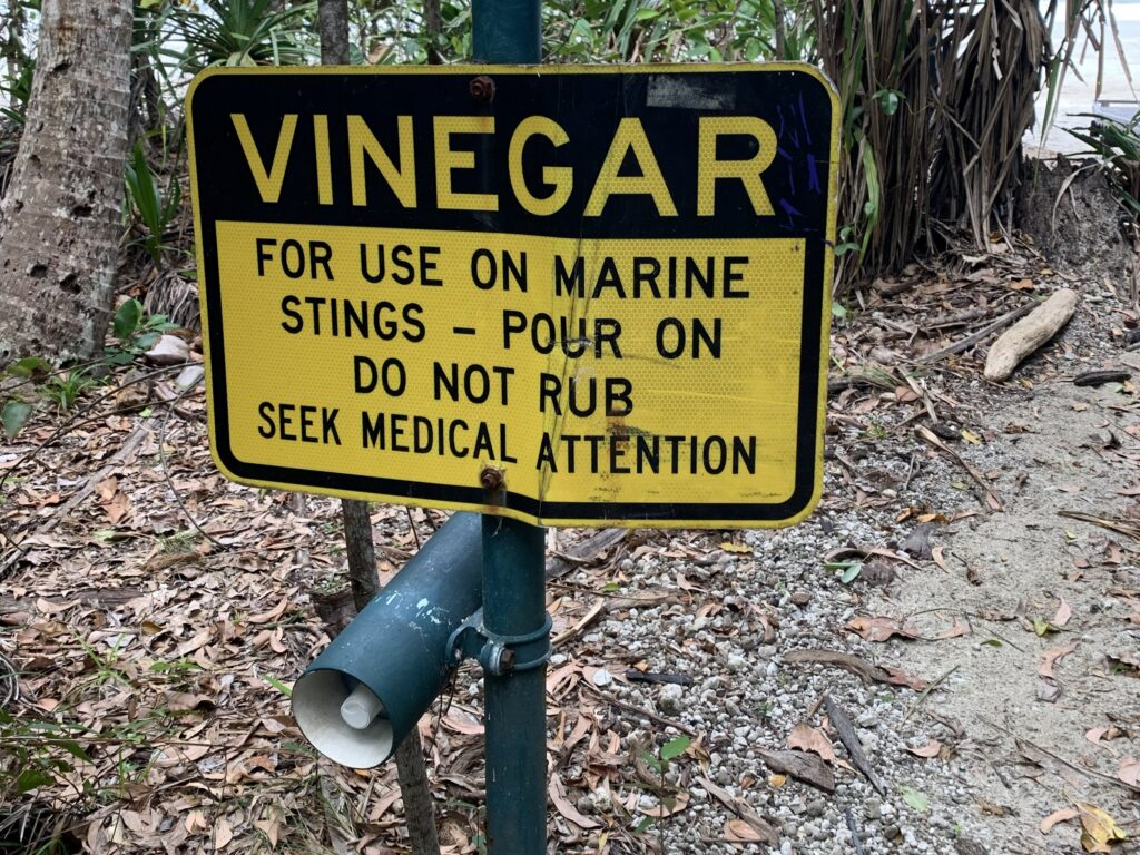Sign near the beach at Cape Tribulation with Vinegar, the treatment for marine stingers.